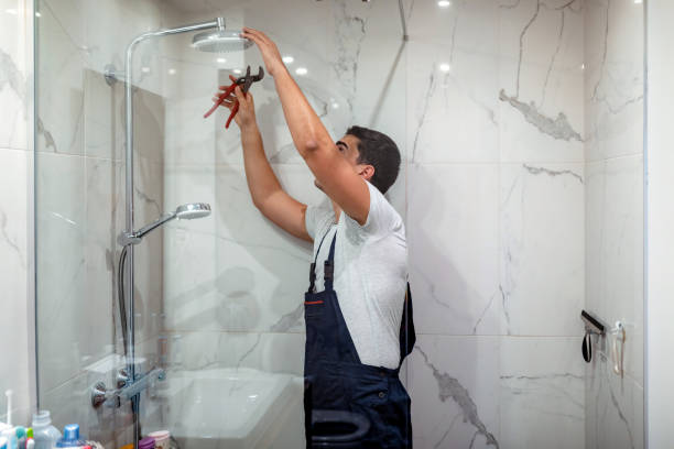 plumber-repairing-a-tap-in-the-b.png